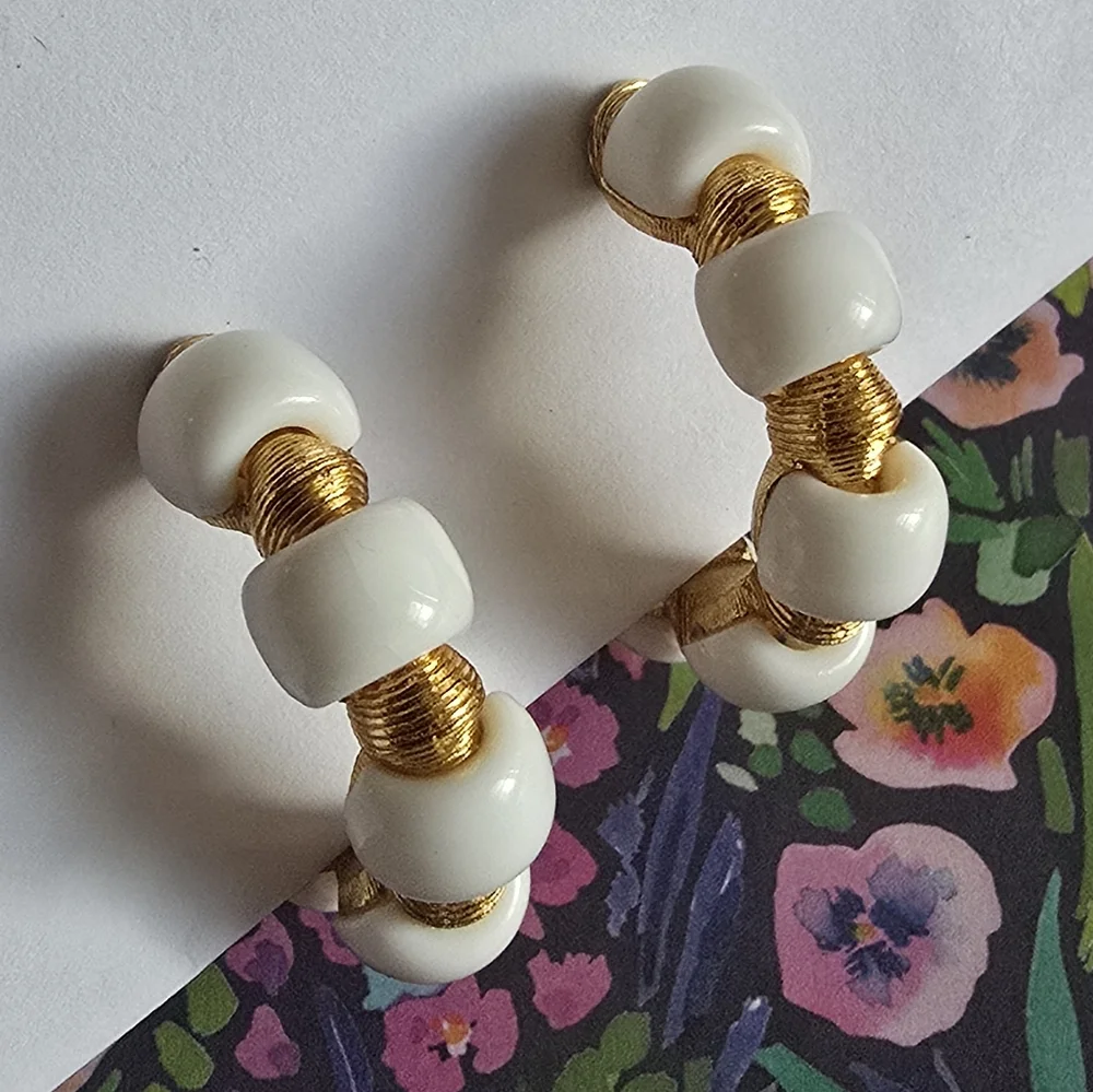 Vintage Trifari earrings Crown hoop white plastic gold tone metal clip on